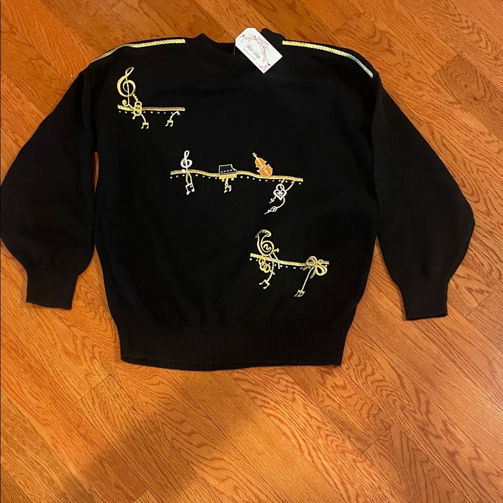 Elegant Black Crewneck Sweater‎ with Gold Music Accents